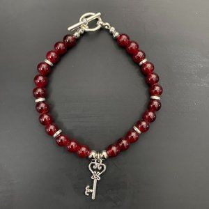 Beaded Bracelet - Maroon beads with silver Key Charm